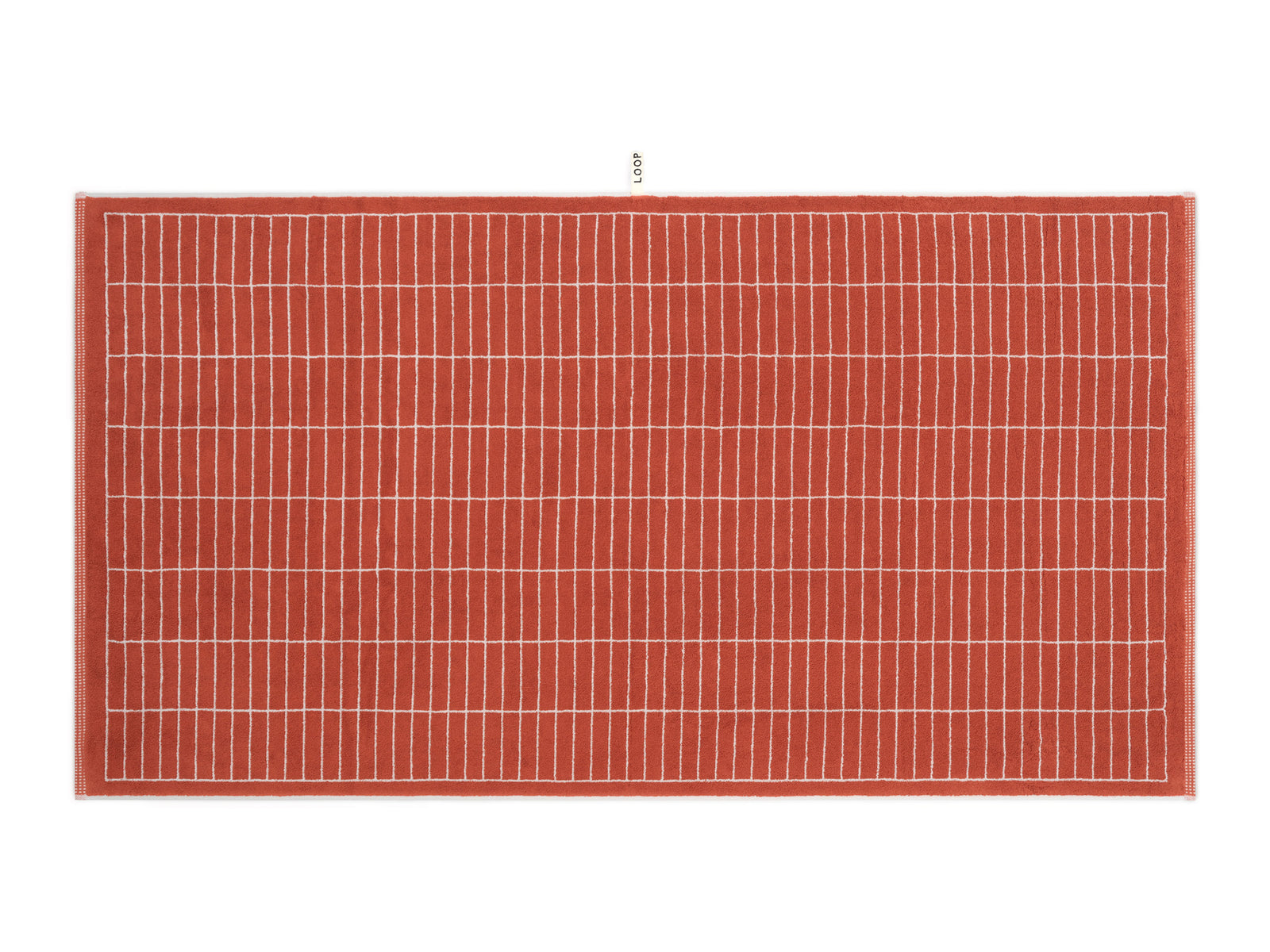 LOOP HOME terracotta and stone bath sheet folded showing woven texture