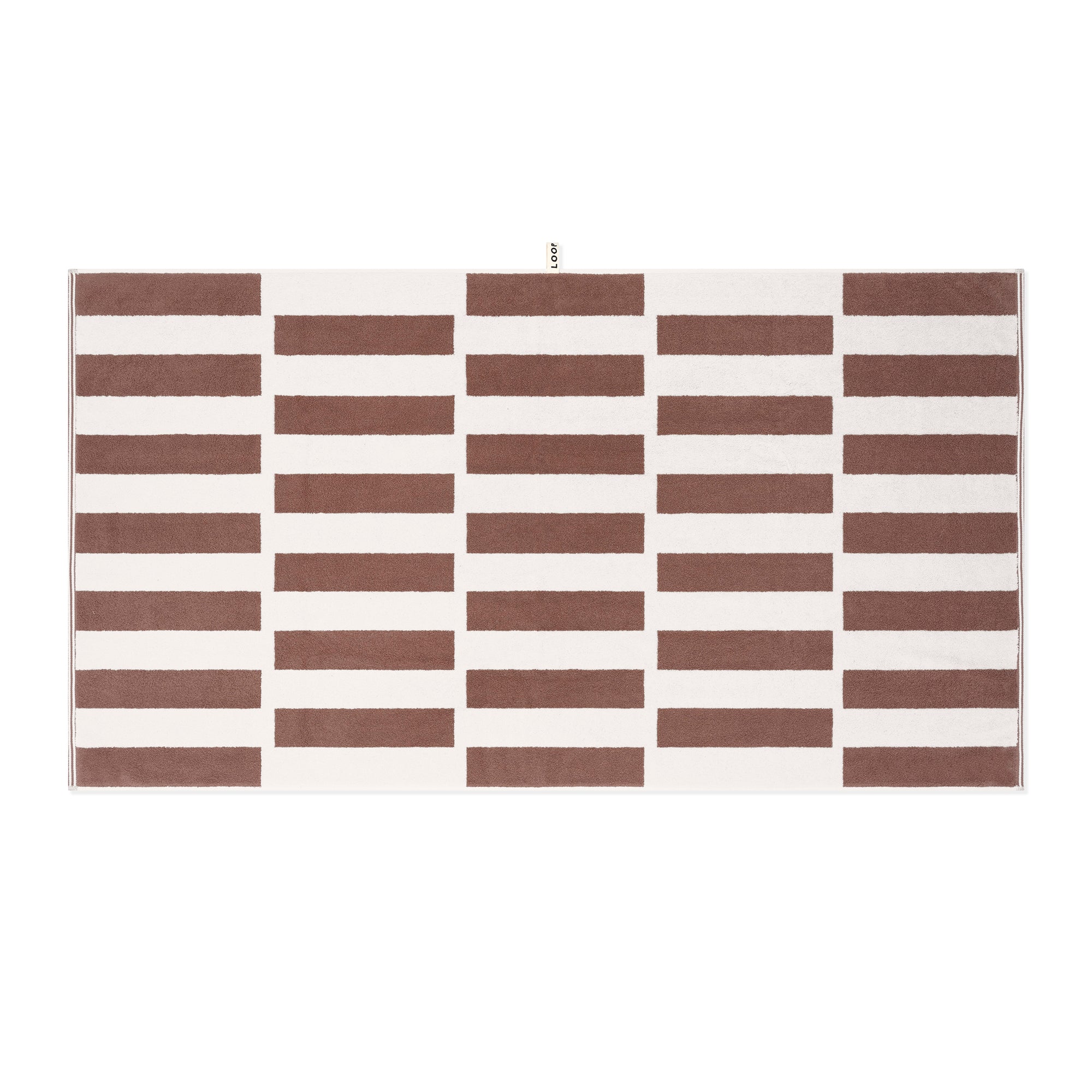 LOOP HOME cobalt and ivory hand towel folded showing shift pattern