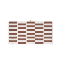 LOOP HOME cobalt and ivory bath towel folded on plain background