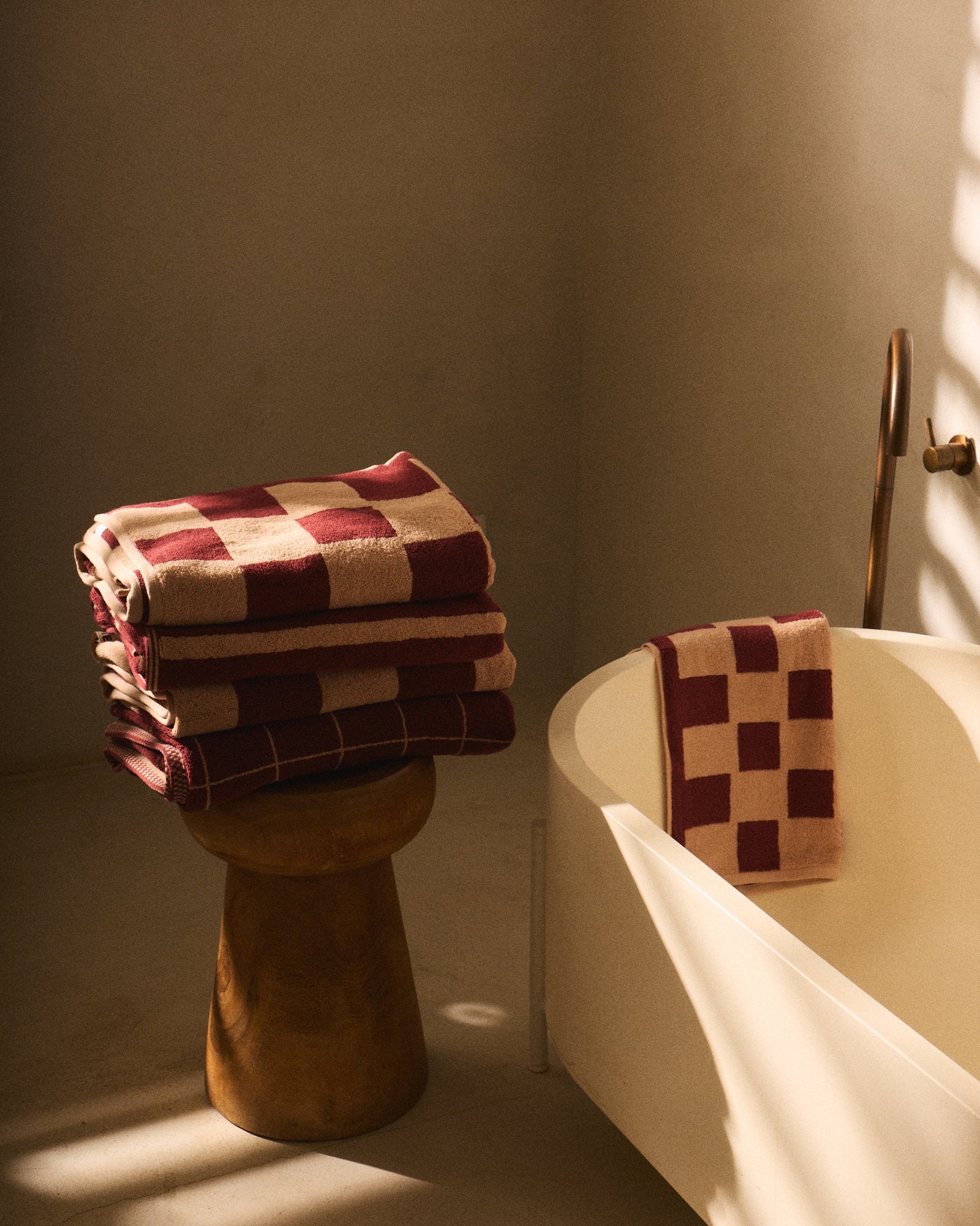 Loop Home organic cotton towels styled in a contemporary bathroom setting