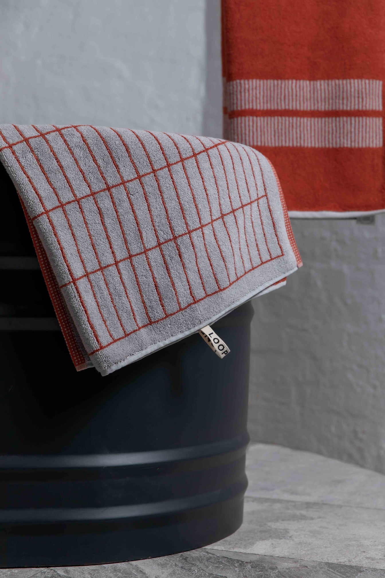 Loop Home towels folded and styled in a warm earthy interior setting